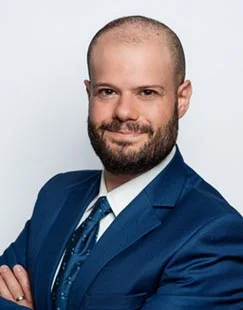 Josh Katz, a Certified Public Accountant (CPA) specializing in US expat taxes, wearing professional attire and smiling confidently.